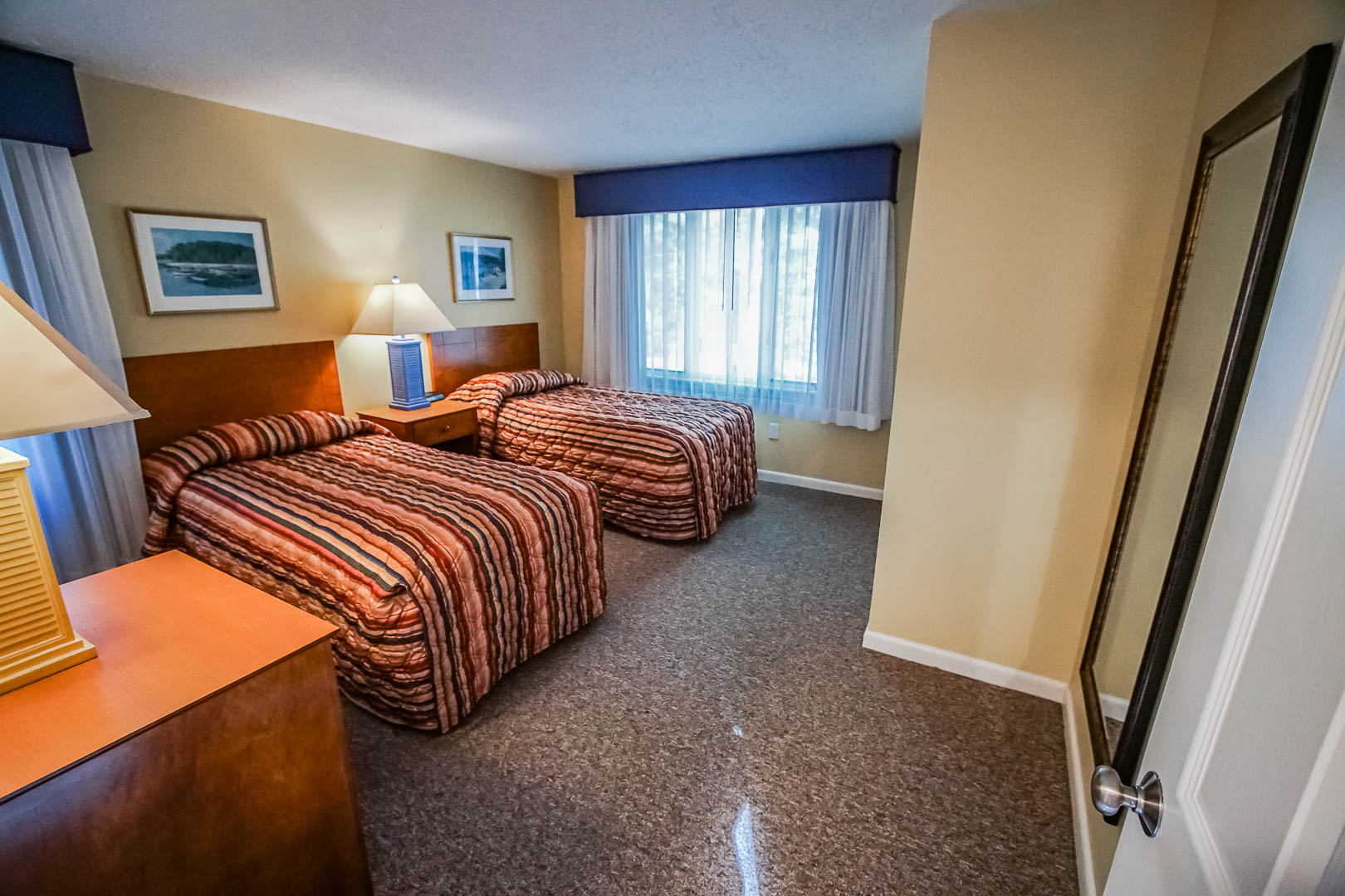 A two bedroom unit with double beds at VRI's Cape Cod Holiday Estates in Massachusetts.